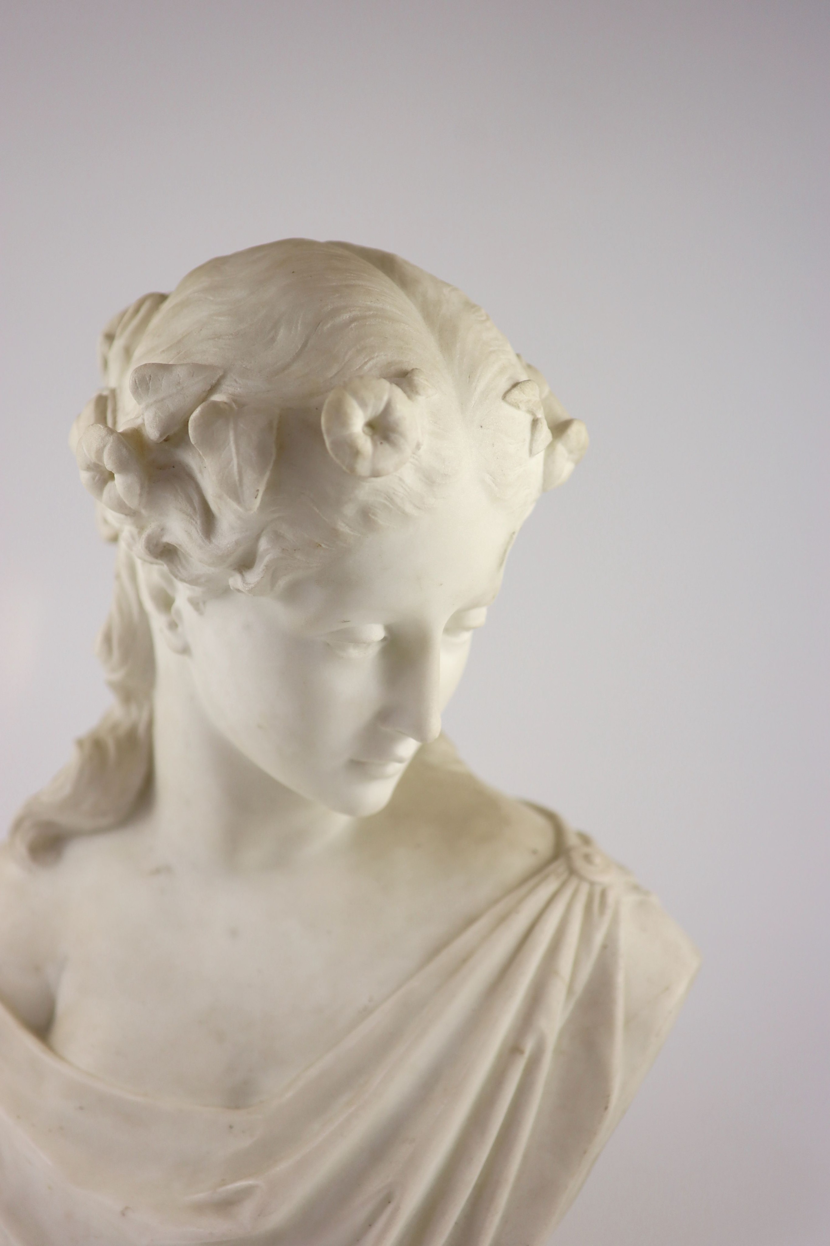 Prof. Pietro Lazzerini (Italian, 1842-1918), a carrara marble bust of a maiden H 43cm.